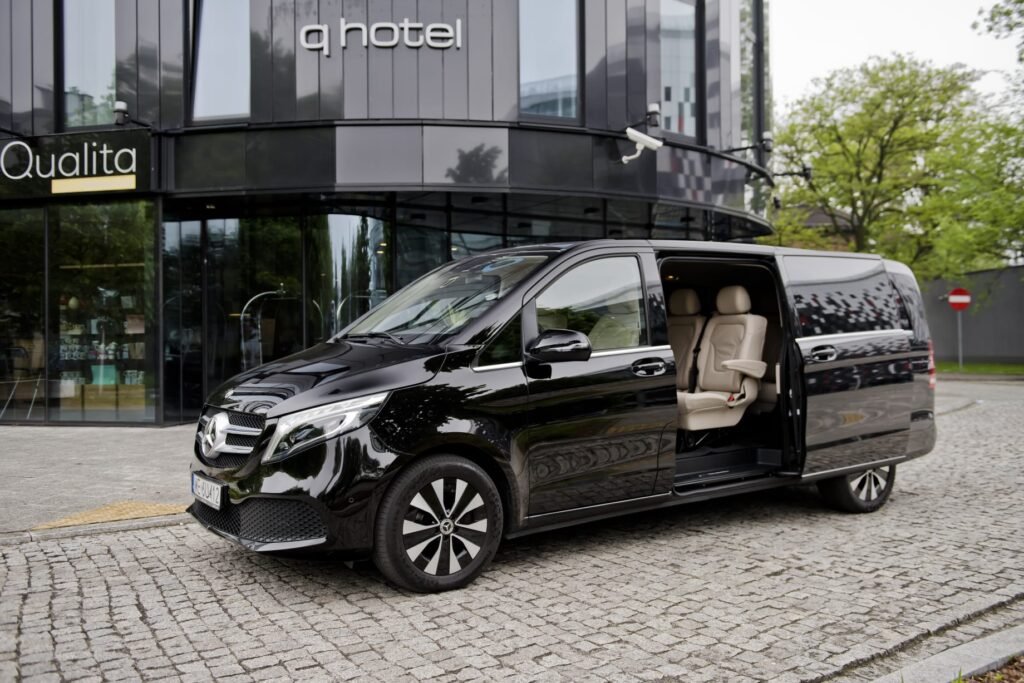 Amsterdam airport transfer cost with luxury chauffeur vehicle outside Schiphol Airport