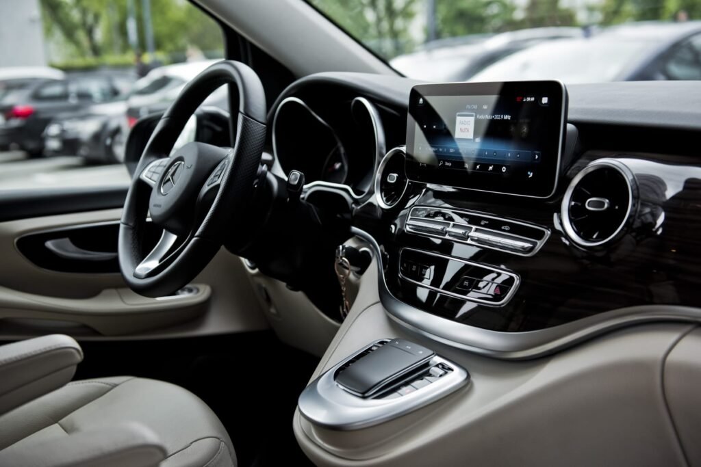 Amsterdam airport transfer cost with luxury chauffeur vehicle outside Schiphol Airport